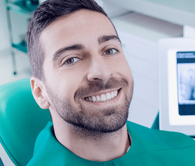 man smiling in dental chair