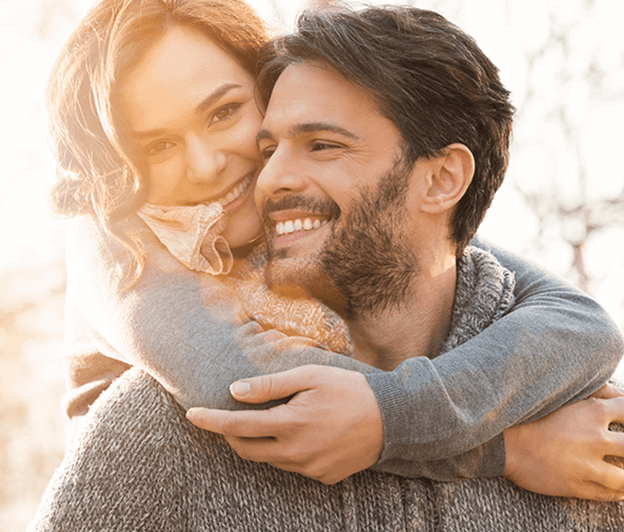 woman hugging man from behind