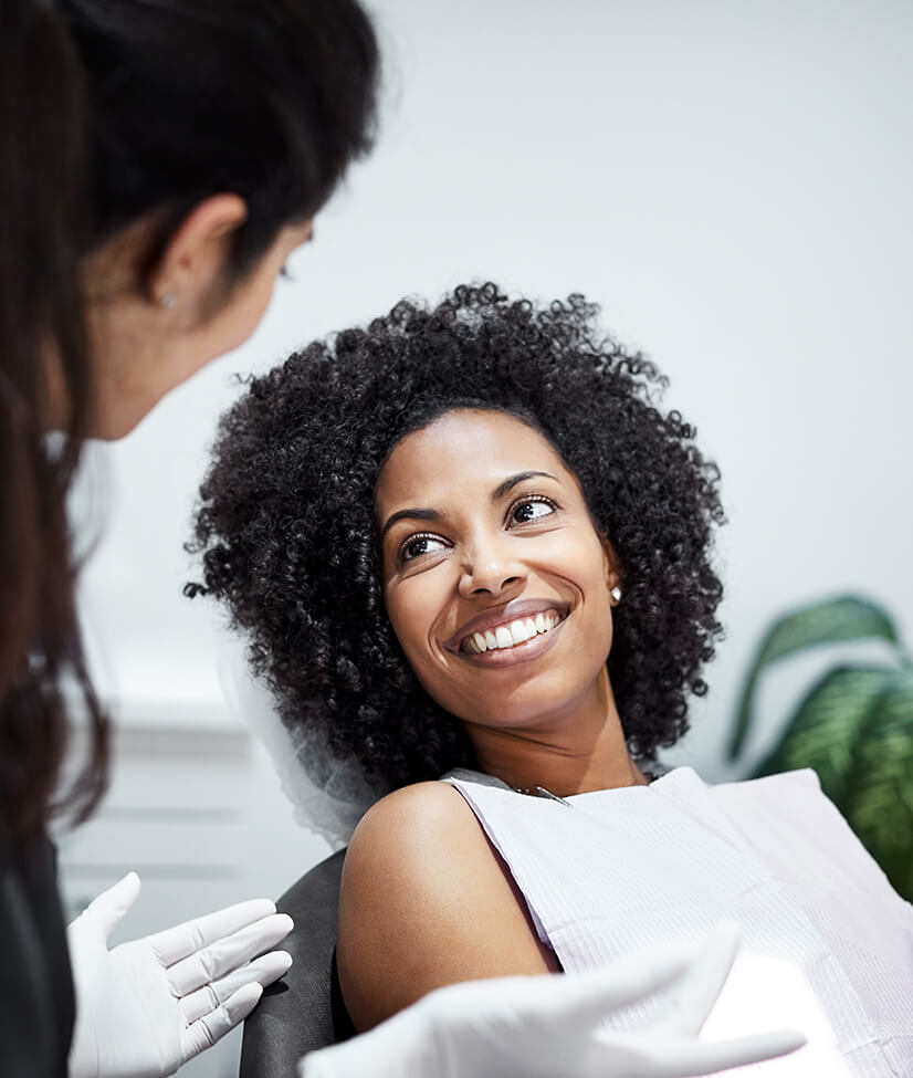 smiling woman sitting in a dental chair